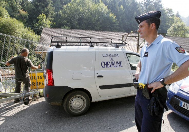 French gendarmes block access to a road to La Combe d'Ire in Chevaline