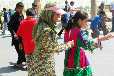 Khorshid  (left) and a friend skating together during Go Skateboarding Day 2011.