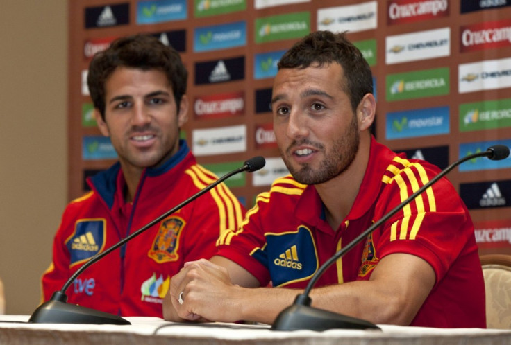 Cesc Fabregas and Santi Cazorla (R)