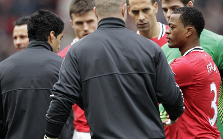 Luis Suarez and Patrice Evra