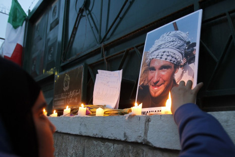 A Jordanian woman lights candles during a protest against the killing of Italian activist Vittorio Arrigoni in Amman