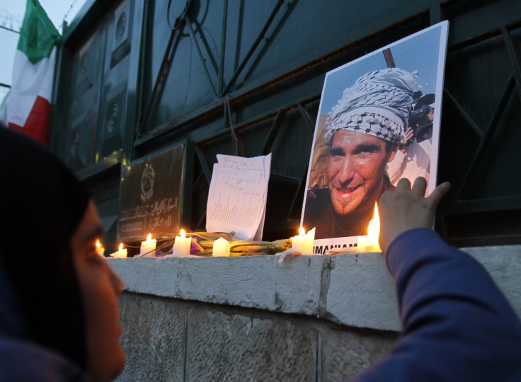 A Jordanian woman lights candles during a protest against the killing of Italian activist Vittorio Arrigoni in Amman