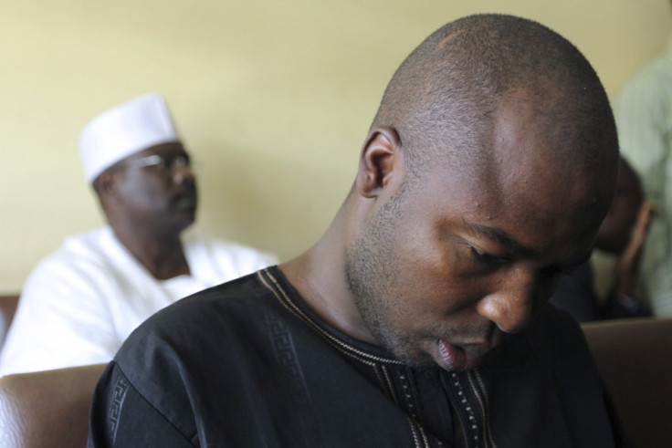 Suspected member of Islamic sect Boko Haram, Konduga sits inside Wuse Magistrate court next to senator Ndume during his trial (Reuters)
