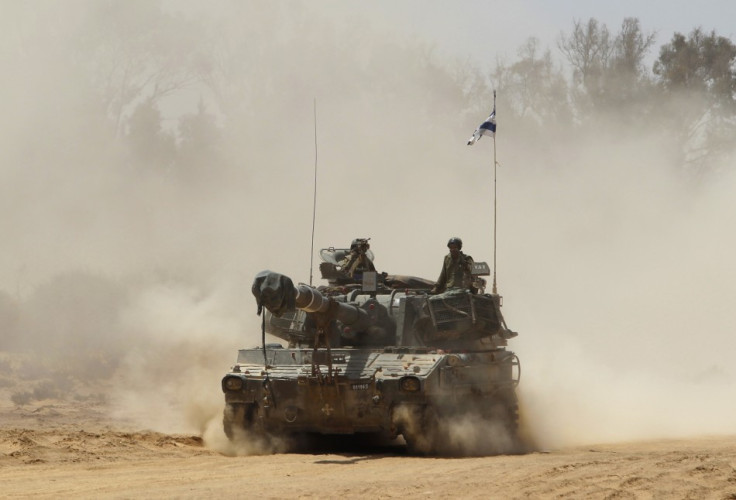 An Israeli mobile artillery unit travels after a live-fire display during a conference held by the Israeli Defence Force