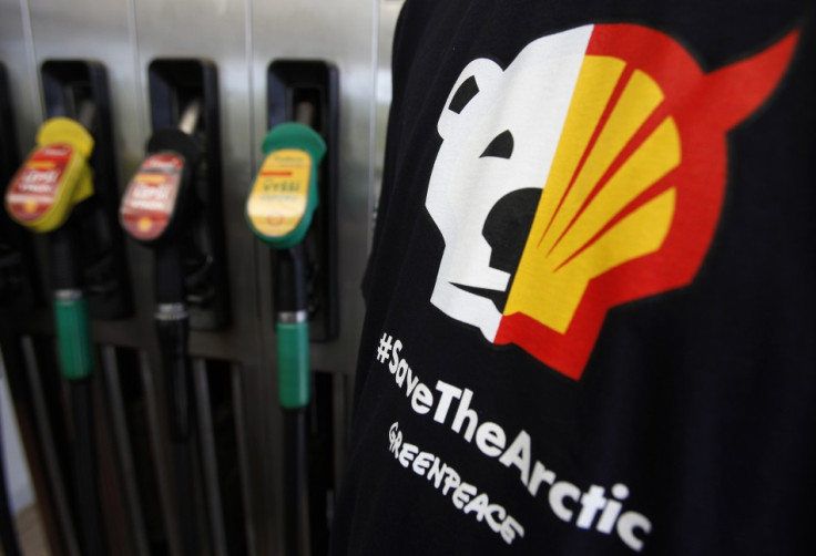 A T-shirt of a Greenpeace environmental activist is seen next to gas pumps at a Shell gas station in Prague (Reuters)