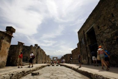 Visitors walk in Pompeii, the famous city next to Naples which was destroyed in AD 79 by the eruption of Mount Vesuvius. Rare artefacts from Pompeii will go on show at British Museum in 2013. (Photo: REUTERS/Giampiero Sposito)