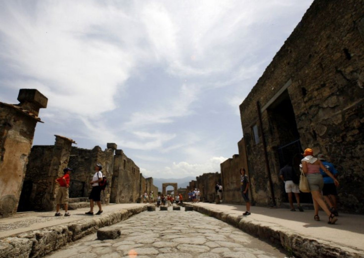 Visitors walk in Pompeii, the famous city next to Naples which was destroyed in AD 79 by the eruption of Mount Vesuvius. Rare artefacts from Pompeii will go on show at British Museum in 2013. (Photo: REUTERS/Giampiero Sposito)