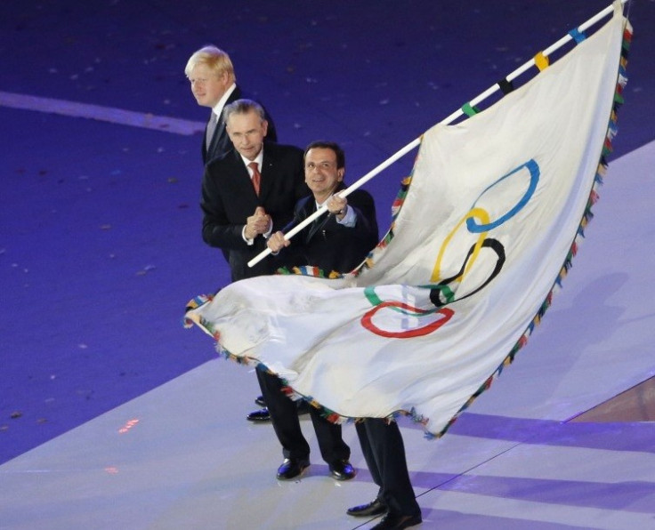 Rio de Janeiro Mayor Eduardo da Costa Paes waves Olympic flag at London Olympics' closing ceremony