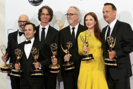Steven Shareshian, Jay Roach, Danny Strong, Gary Goetzman, Julianne Moore and Tom Hanks hold their Emmy awards for outstanding miniseries or movie for "Game Change" at the 64th Primetime Emmy Awards in Los Angeles. (Photo: REUTERS)