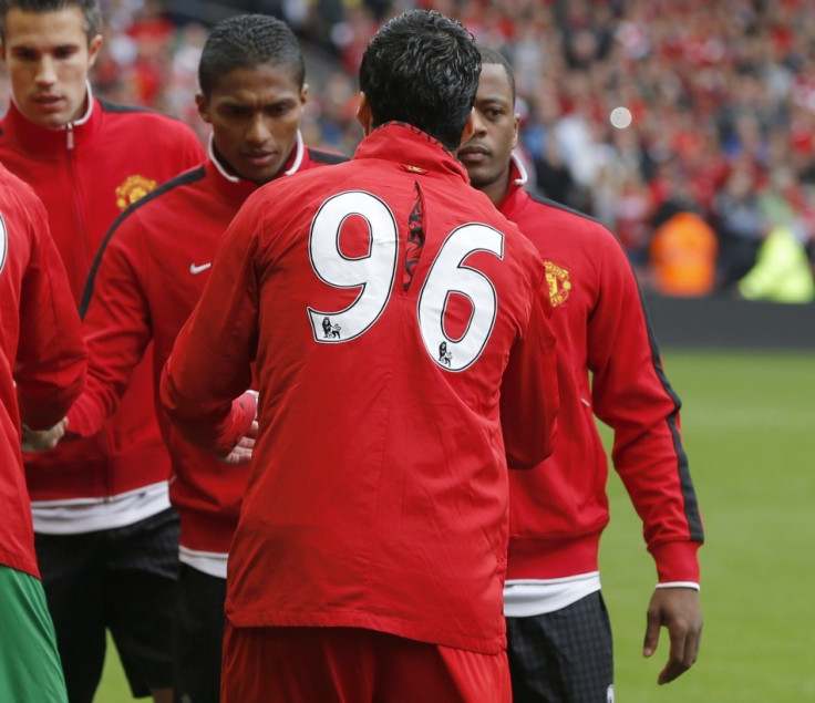 Patrice Evra (R) and Luis Suarez