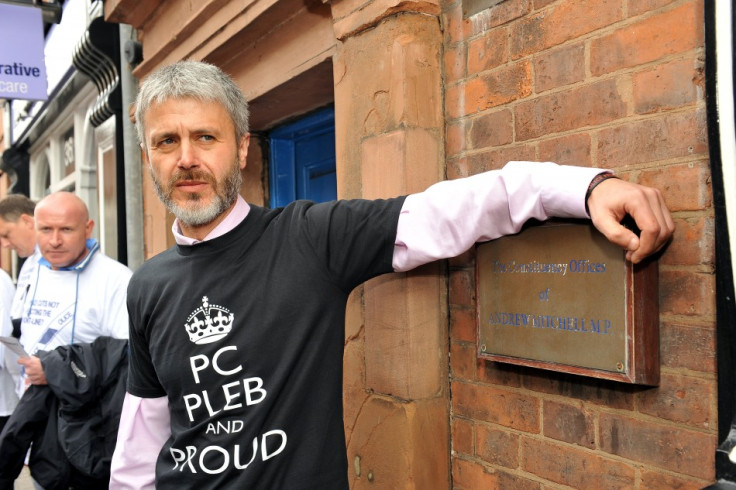 Payne poses in 'Pleb' t-shirt at Mitchell's office