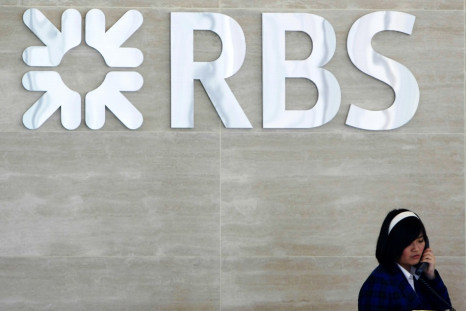 Receptionist speaks on phone at lobby of RBS office in Singapore (Photo: Reuters)