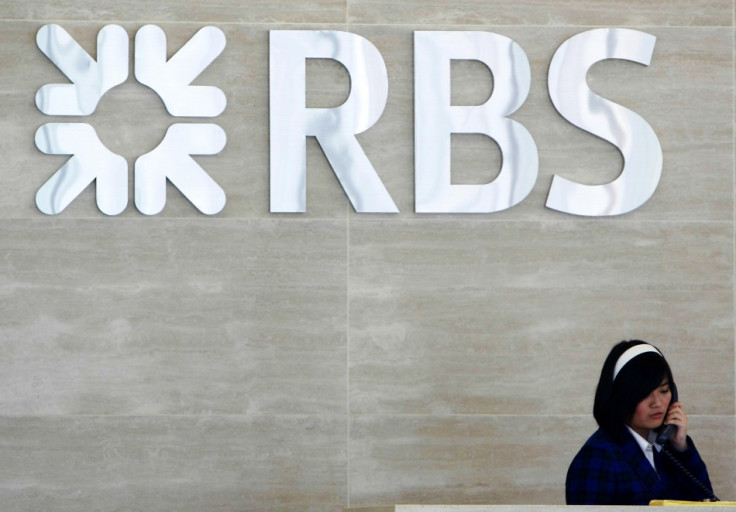 Receptionist speaks on phone at lobby of RBS office in Singapore (Photo: Reuters)