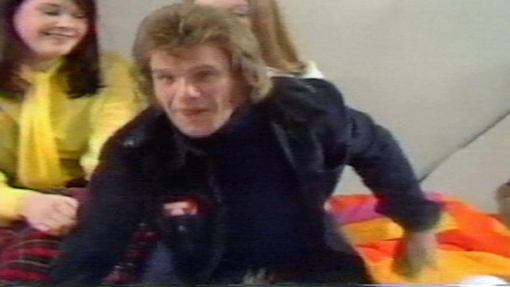 Freddie Starr at the Clunk Click studios, with Karin ward in the background (Channel 4 News)