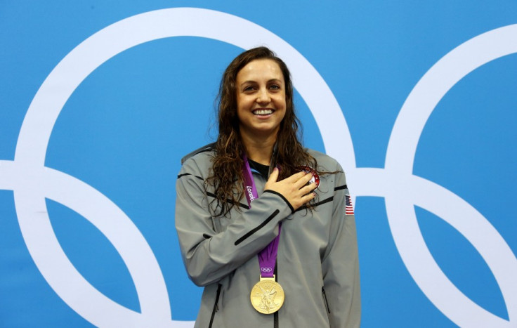 Rebecca Soni of the US smiles with her gold medal during the women's 200m breaststroke victory ceremony in the London 2012 Olympic Games at the Aquatics Centre (Photo: Reuters)