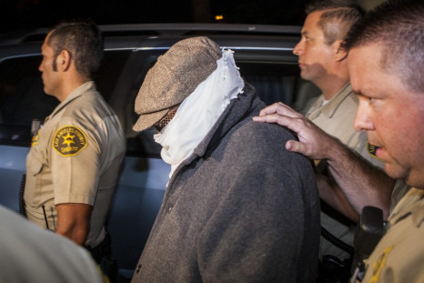 Mark Basseley Yousseff, aka Nakoula Basseley Nakoula is escorted out of him home in California (Reuters)
