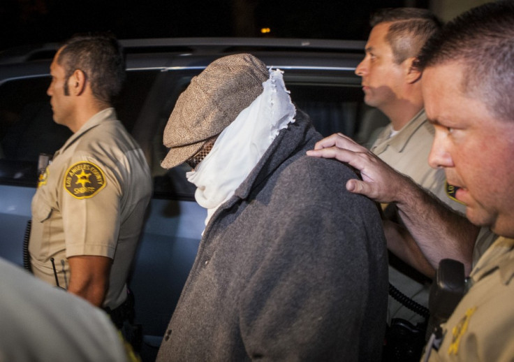 Mark Basseley Yousseff, aka Nakoula Basseley Nakoula is escorted out of him home in California (Reuters)