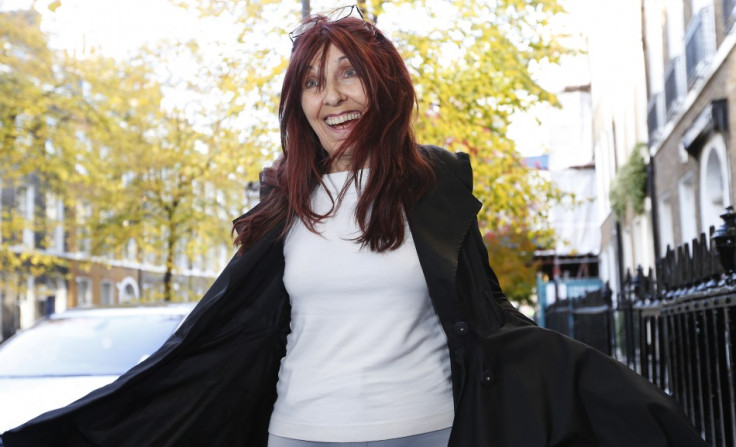 Janis Sharp, the mother Gary McKinnon reacts as she arrives at a news conference (Reuters)