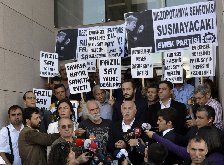 Supporters of Turkish classical pianist Fazil Say demonstrate in front of the court house in Istanbul