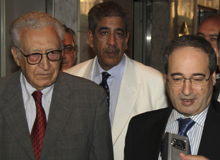 Syria's Deputy Foreign Minister Faisal Mekdad (R) speaks to reporters next to U.N.-Arab League peace envoy for Syria Lakhdar Brahimi (L)