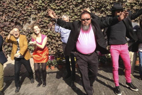 Handout photo of dissident Chinese artist Ai Weiwei dancing
