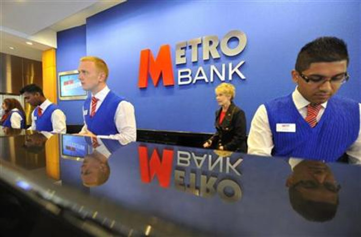 Staff serve customers at the first branch of Metro Bank in Holborn in central London