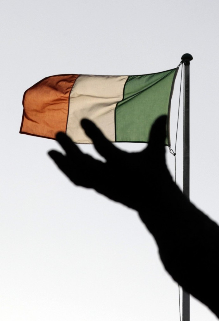 Ireland's national flag flies above a statue on O'Connell Street in Dublin December 5, 2011.