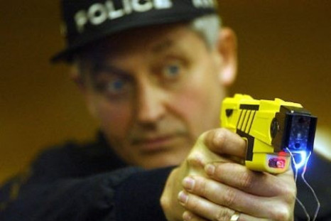 Police demonstrating a Taser gun