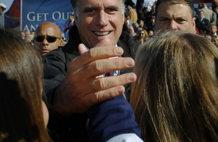 Republican presidential nominee Romney greets audience members at a campaign rally