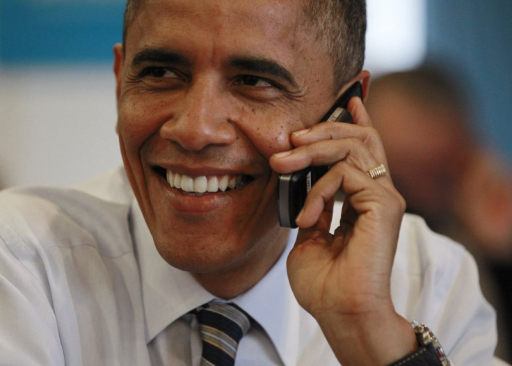 U.S. President Barack Obama makes a phone call to a volunteer for his campaign