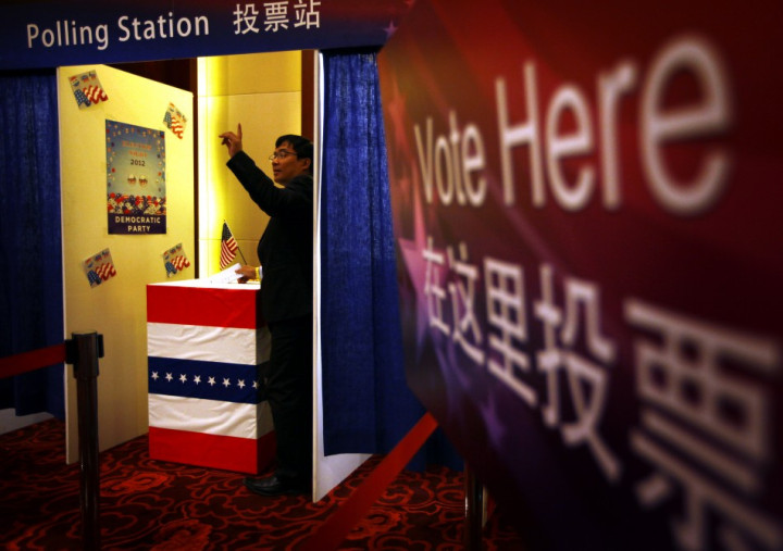 A guest at a Presidential election event, organised by the U.S. embassy, casts his vote for either U.S. President Barack Obama or Republican presidential nominee Mitt Romney at an imitation polling booth in Beijing (Photo: Reuters) A guest at a Presidential election event, organised by the U.S. embassy, casts his vote for either U.S. President Barack Obama or Republican presidential nominee Mitt Romney at an imitation polling booth in Beijing (Photo: Reuters)