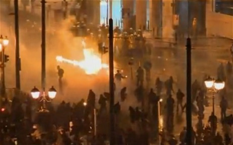 Molotov cocktails were thrown at the police by protestors in Athens (Twitter) Molotov cocktails were thrown at the police by protestors in Athens (Twitter)