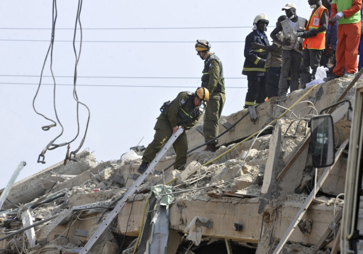 Members of an Israeli military team search for survivors among the debris of a collapsed shopping mall in Accra (Reuters)