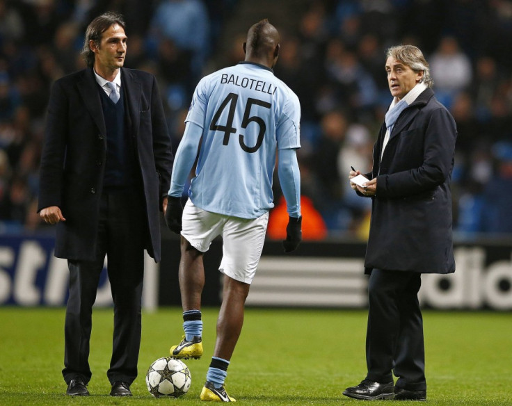 Roberto Mancini (R) and Mario Balotelli