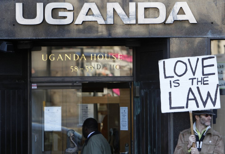 An activist holds a banner during a gay rights protest outside Uganda House in Trafalgar Square in London