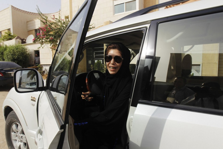 Female driver Azza Al Shmasani alights from her car after driving in defiance of the ban in Riyadh