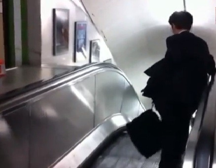 Wrong way: Commuter on escalator
