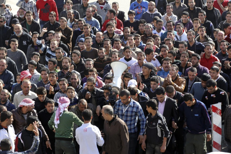 Anti-government protesters shout slogans during a demonstration