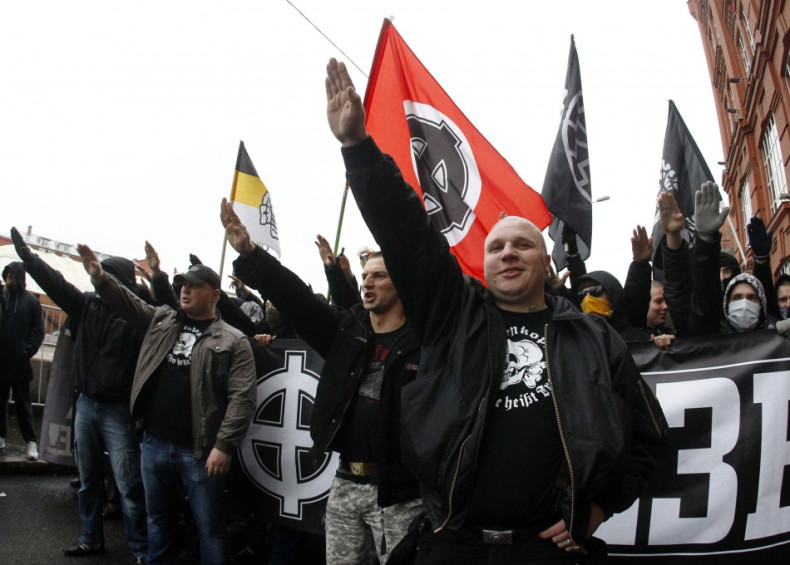 Russian nationalists shout as they attend a "Russian March" demonstration on National Unity Day in Moscow
