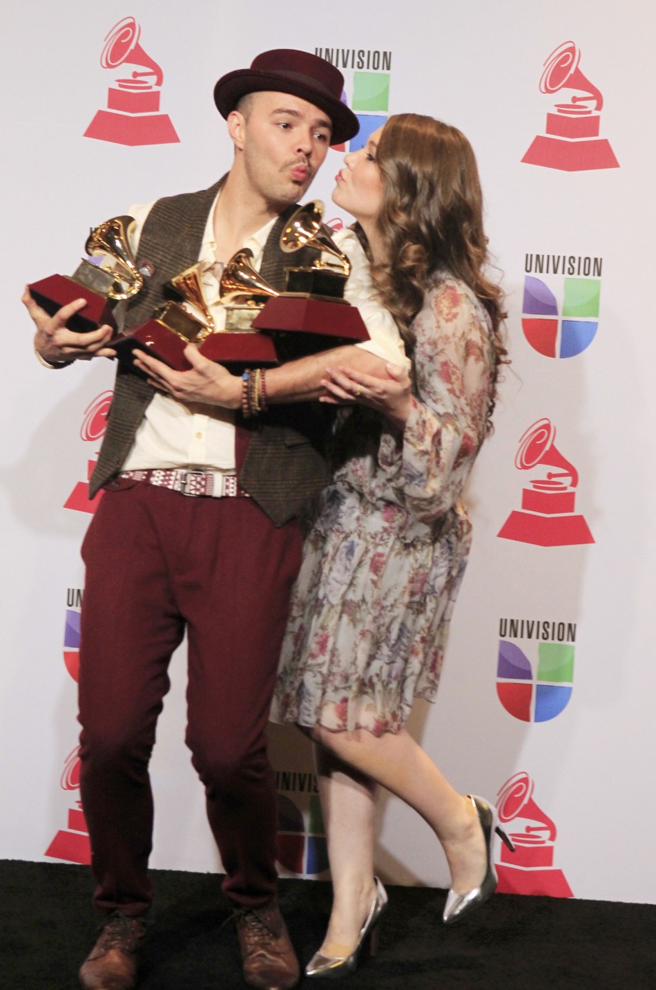 Jesse  Joy pose with their four awards during the 13th Latin Grammy Awards in Las Vegas