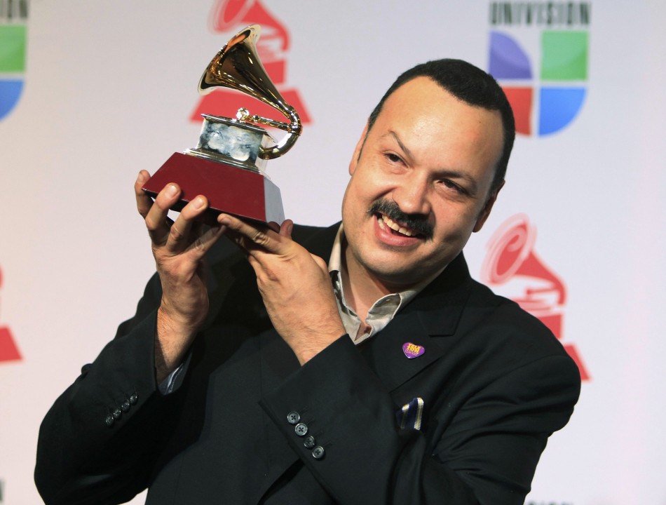 Aguilar poses with award for best ranchero album for Mas De Un Camino during the 13th Latin Grammy Awards in Las Vegas