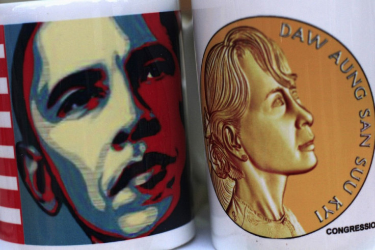 The portrait of U.S. President Obama is seen printed on a cup which is placed next to another with the portrait of Aung Sun Suu Kyi (Reuters)