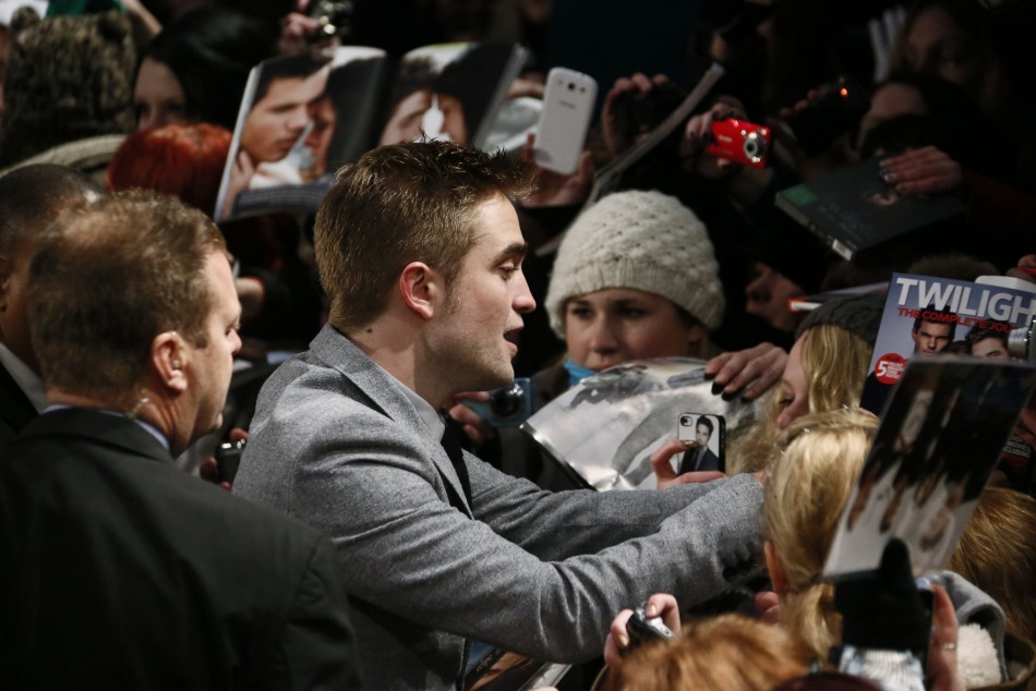 Cast member Pattinson signs autographs before German premiere of The Twilight Saga Breaking Dawn Part 2 in Berlin