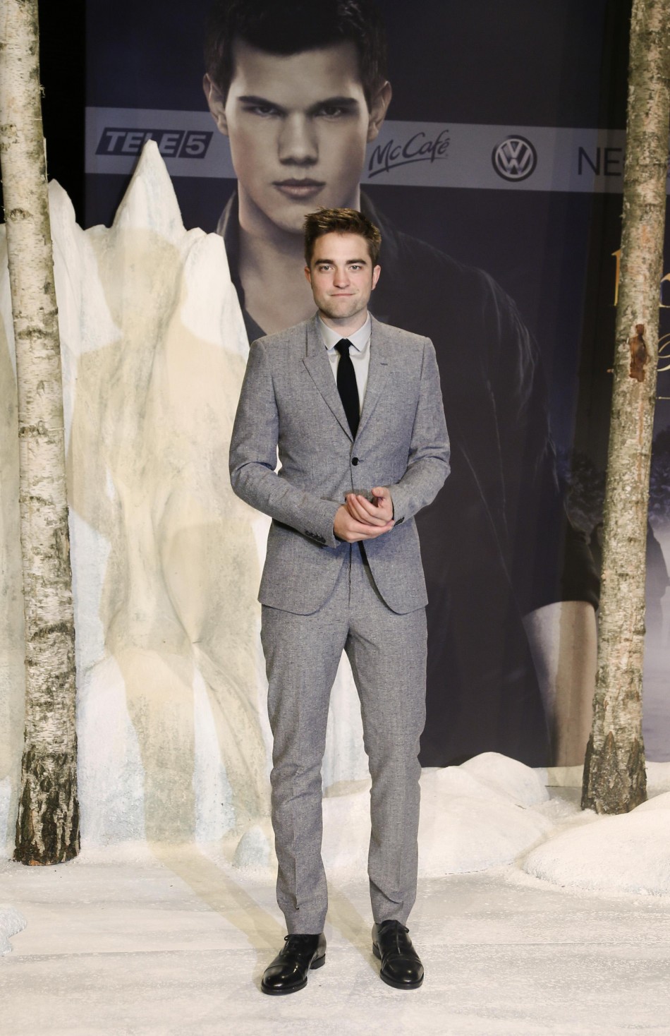 Pattinson poses for pictures before German premiere of The Twilight Saga Breaking Dawn Part 2 in Berlin