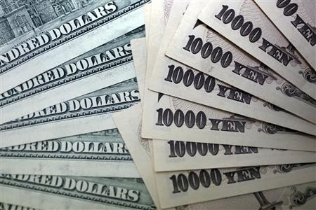 Japanese 10,000 yen notes spread out next to U.S. dollar bills Japanese 10,000 yen notes spread out next to U.S. dollar bills