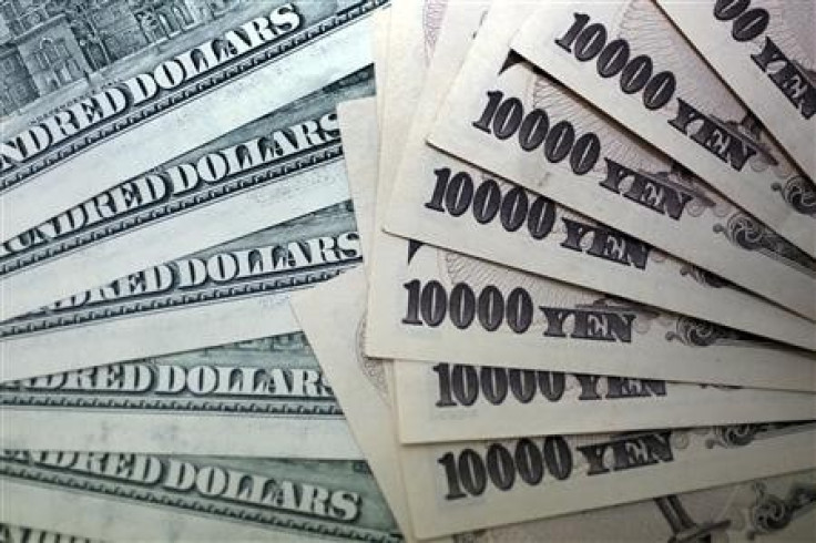 Japanese 10,000 yen notes spread out next to U.S. dollar bills