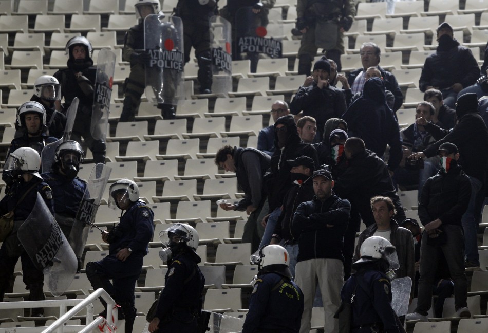 Lazio fans are surrounded by riot policemen during their Europa League Group J soccer match against Panathinaikos Lazio fans are surrounded by riot policemen during their Europa League Group J soccer match against Panathinaikos