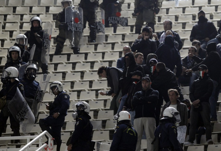 Lazio fans are surrounded by riot policemen during their Europa League Group J soccer match against Panathinaikos