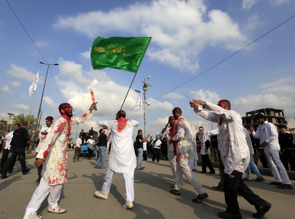 Shiite Iraqi men covered in blood take part in the Ashura procession in Baghdad