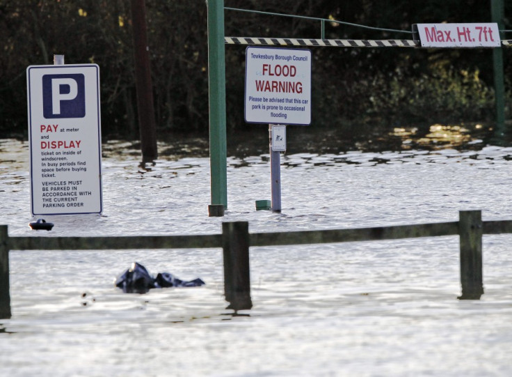 A sign in a car park warns of occasional flooding in Tewkesbury (Reuters)